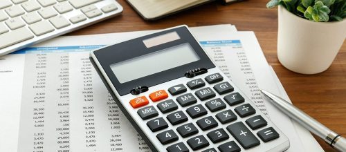 Image of a calculator and budget planner