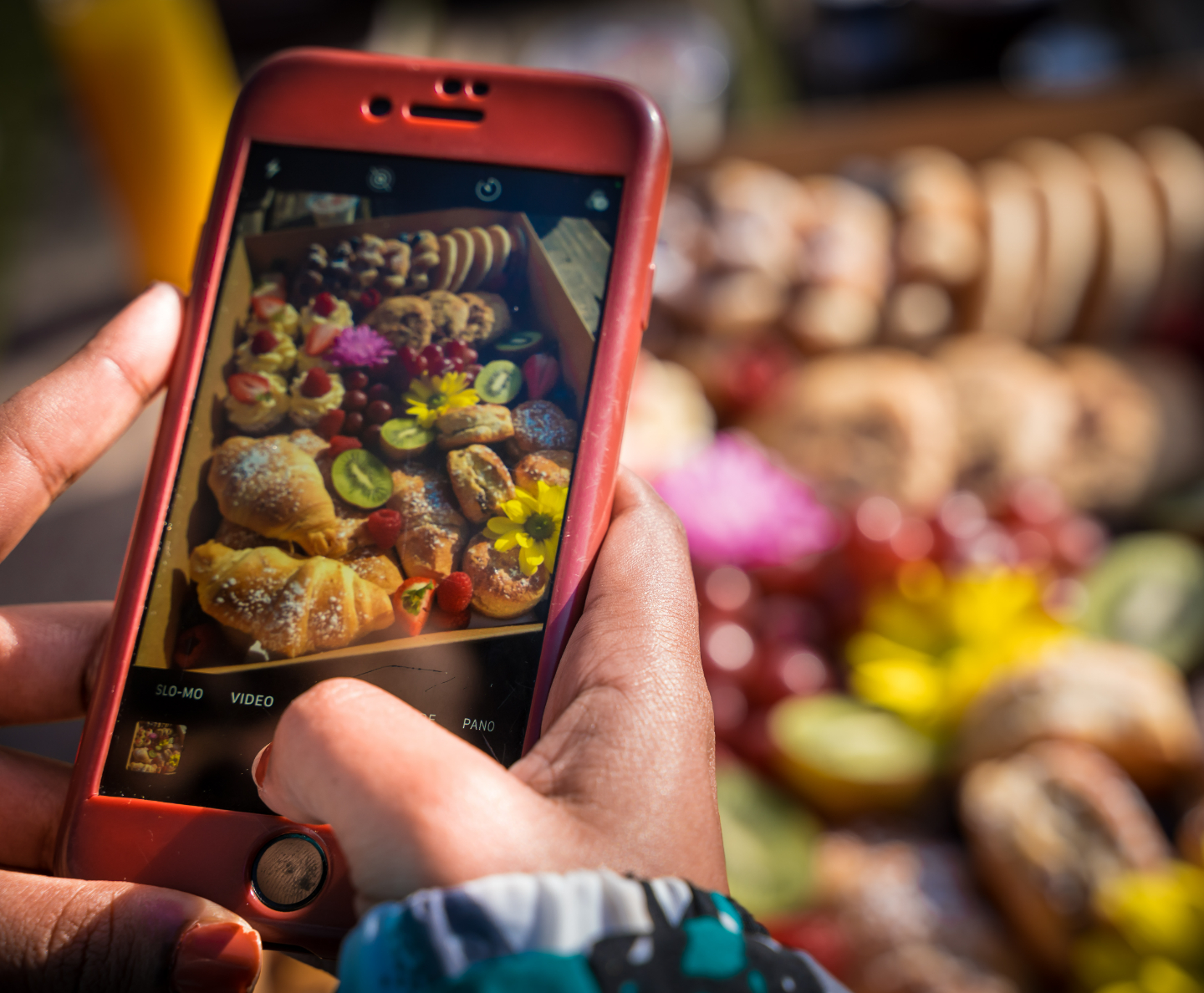 A phone taking photos of veg and fruit