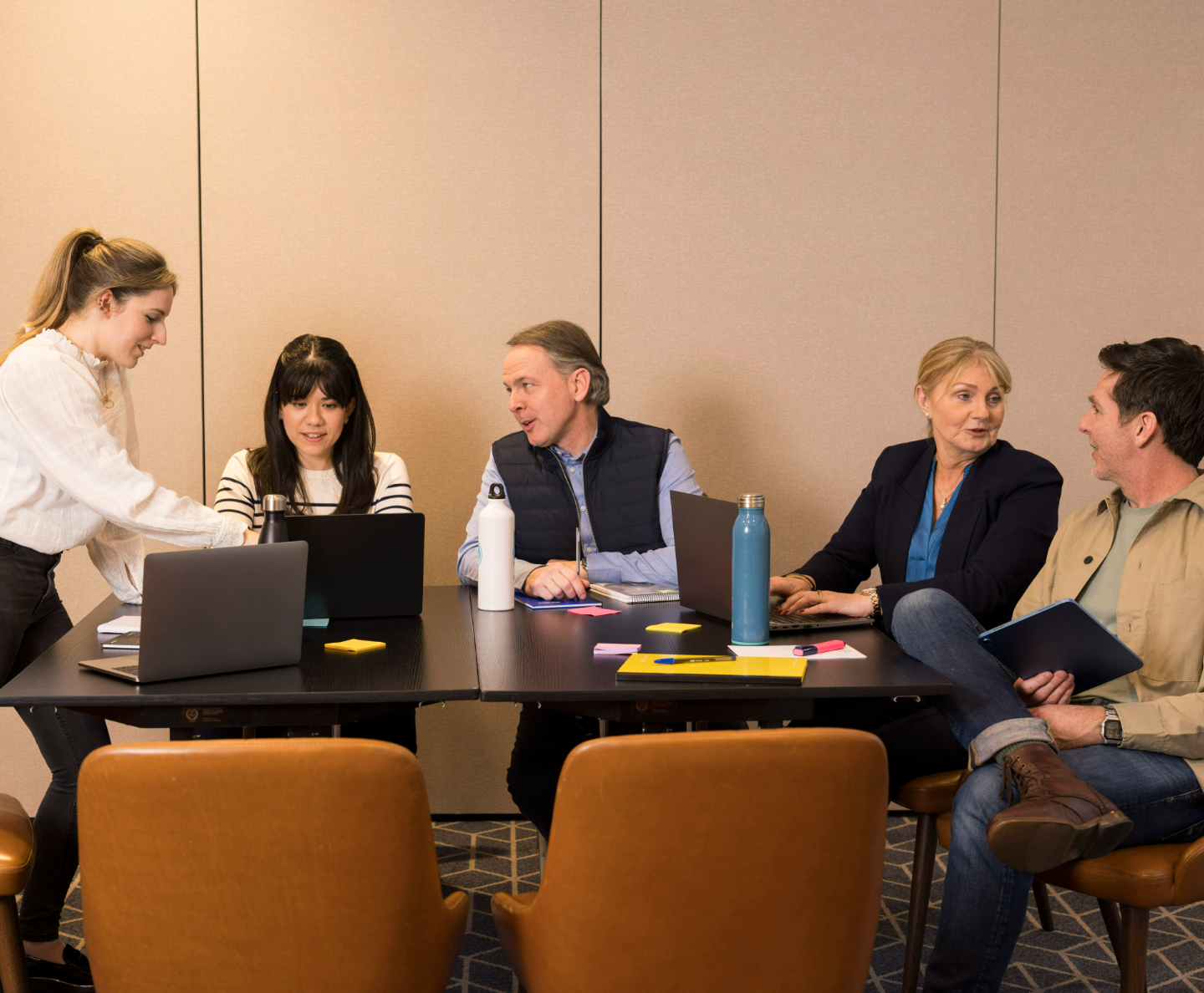 A group of people in a meeting room