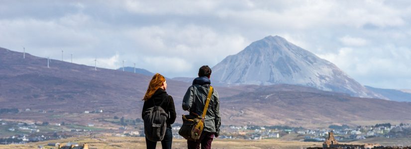 People over looking mountain