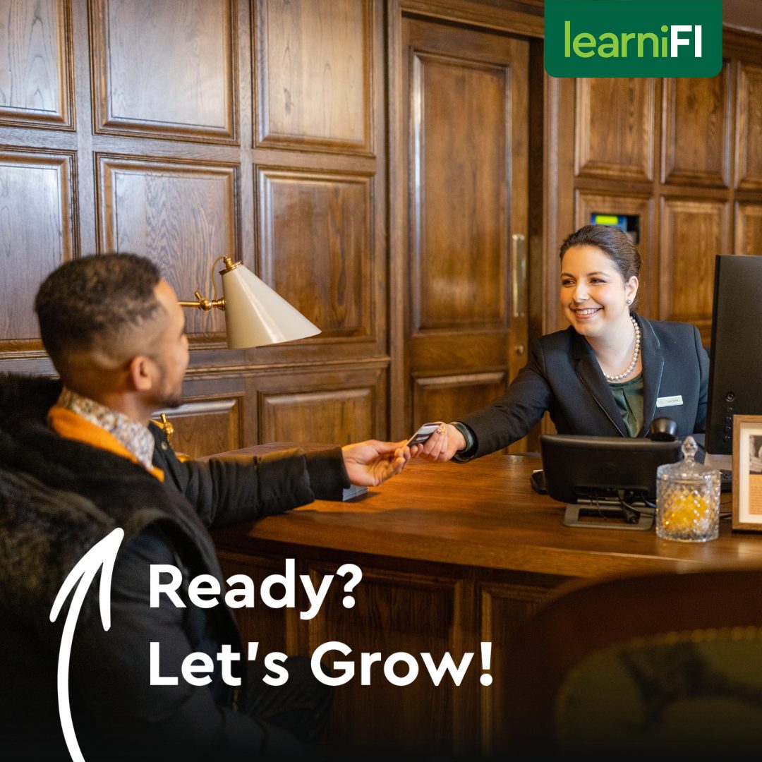 Two people sitting at a desk with a woman handing a card to a man with text reading Ready Let's Grow