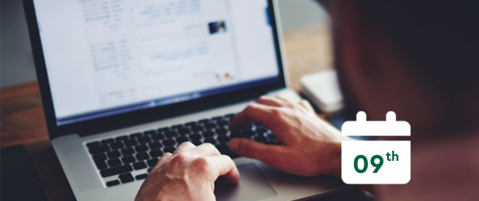 Person typing on computer with a calendar that says 9