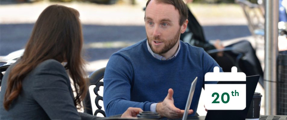 Man and woman talking outside and calendar that says 20th