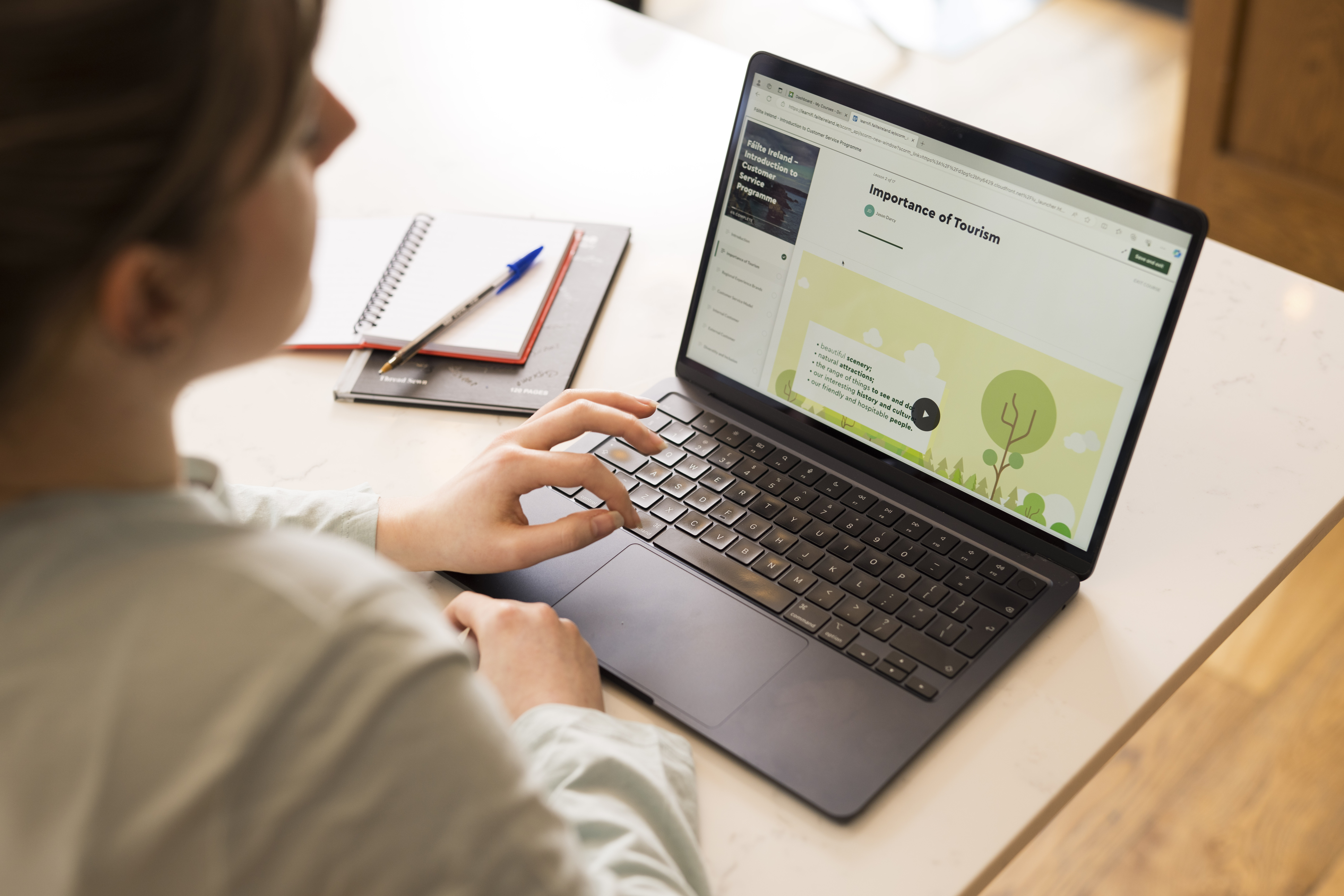 person typing on laptop