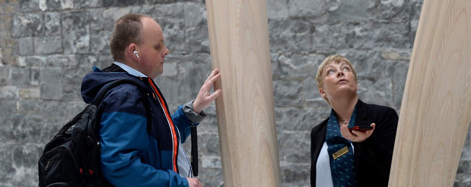 Man in the national gallery on a tour with a female tour guide
