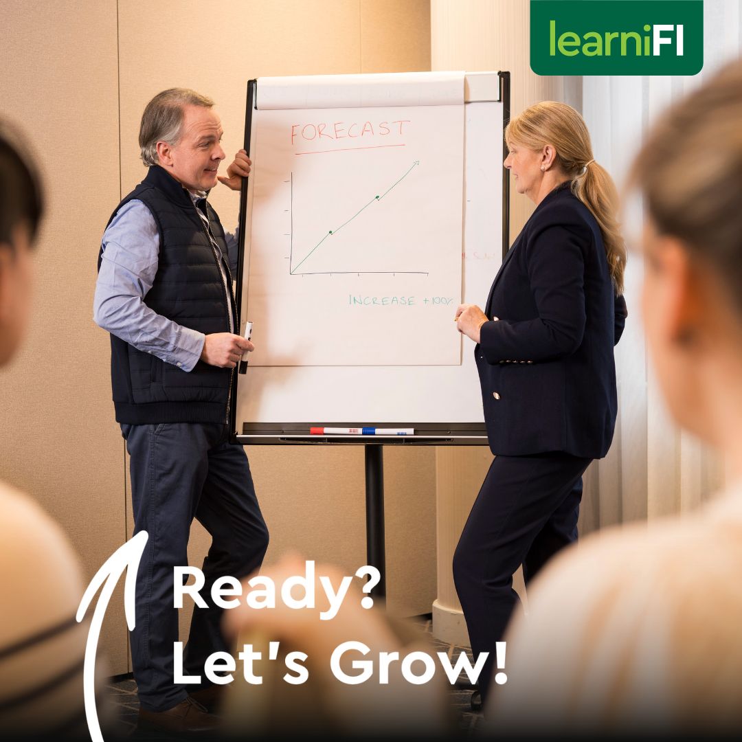 Colleagues looking at chart, text reads: Ready Let's Grow