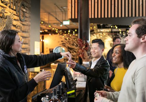 Group of people in a distillery