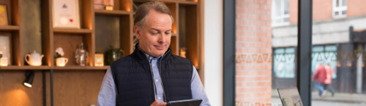 Man holding a tablet in the Haytt hotel in Dublin